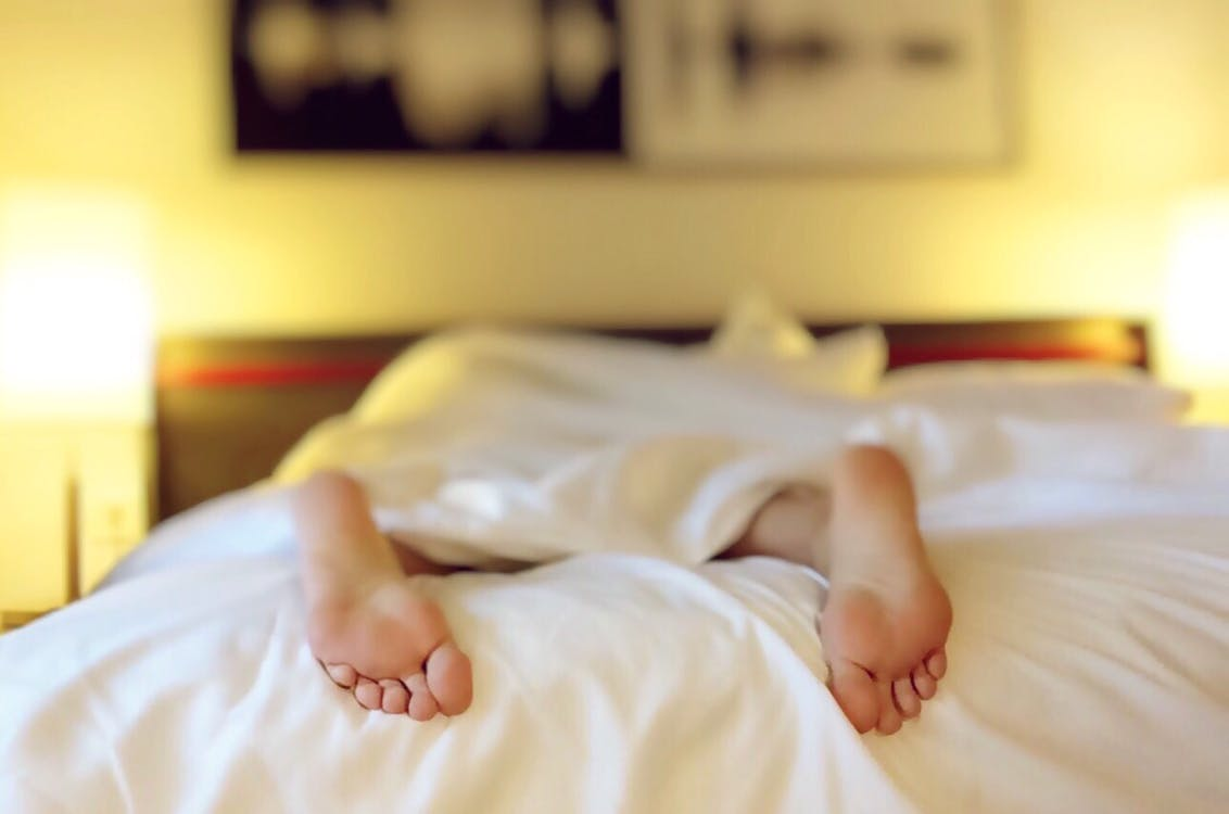 A person relaxing in their hotel room after a massage by Asian Massage 2 You